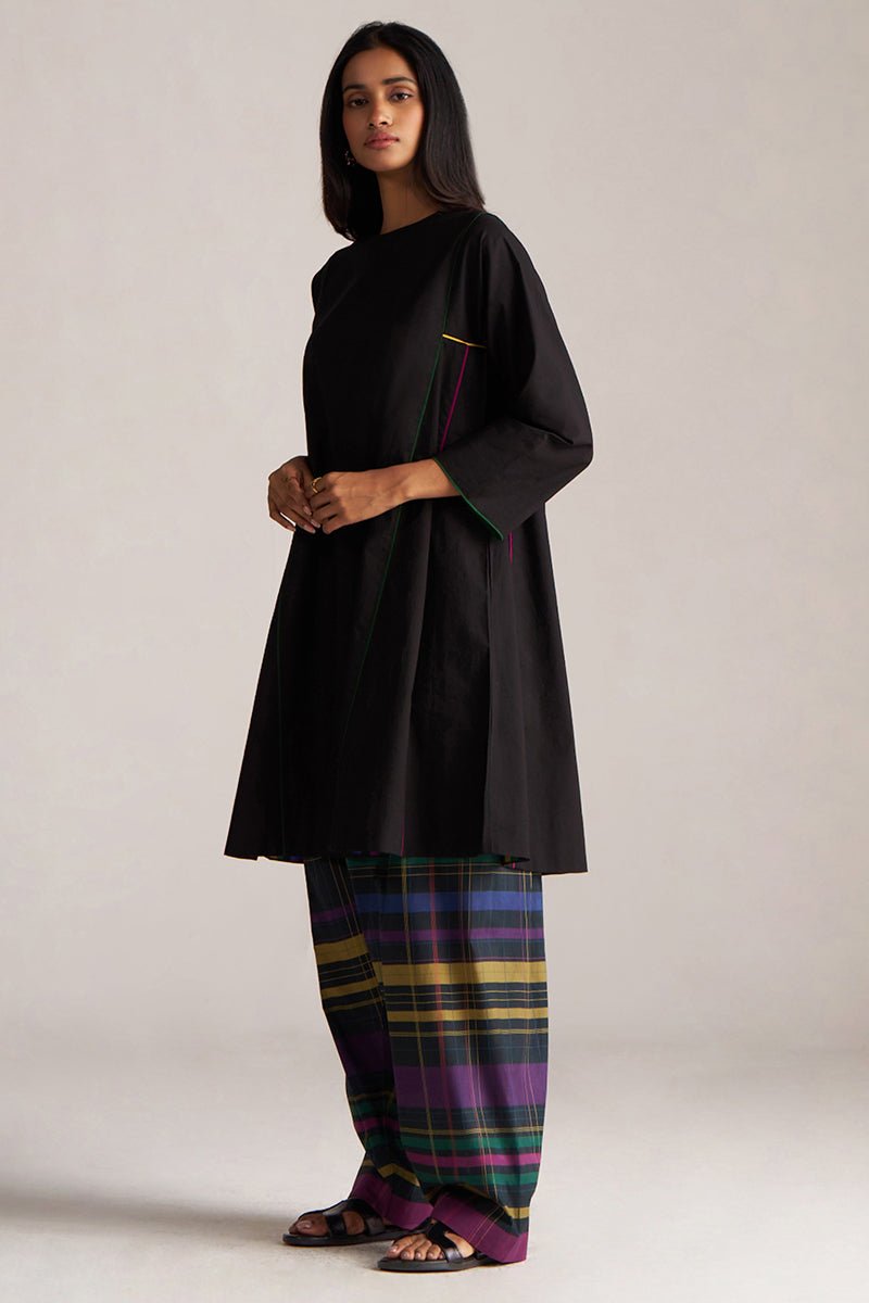 Woman wearing a black outfit with colorful plaid pants on a white background | Black Multi Colour Checkard Co Ord Set