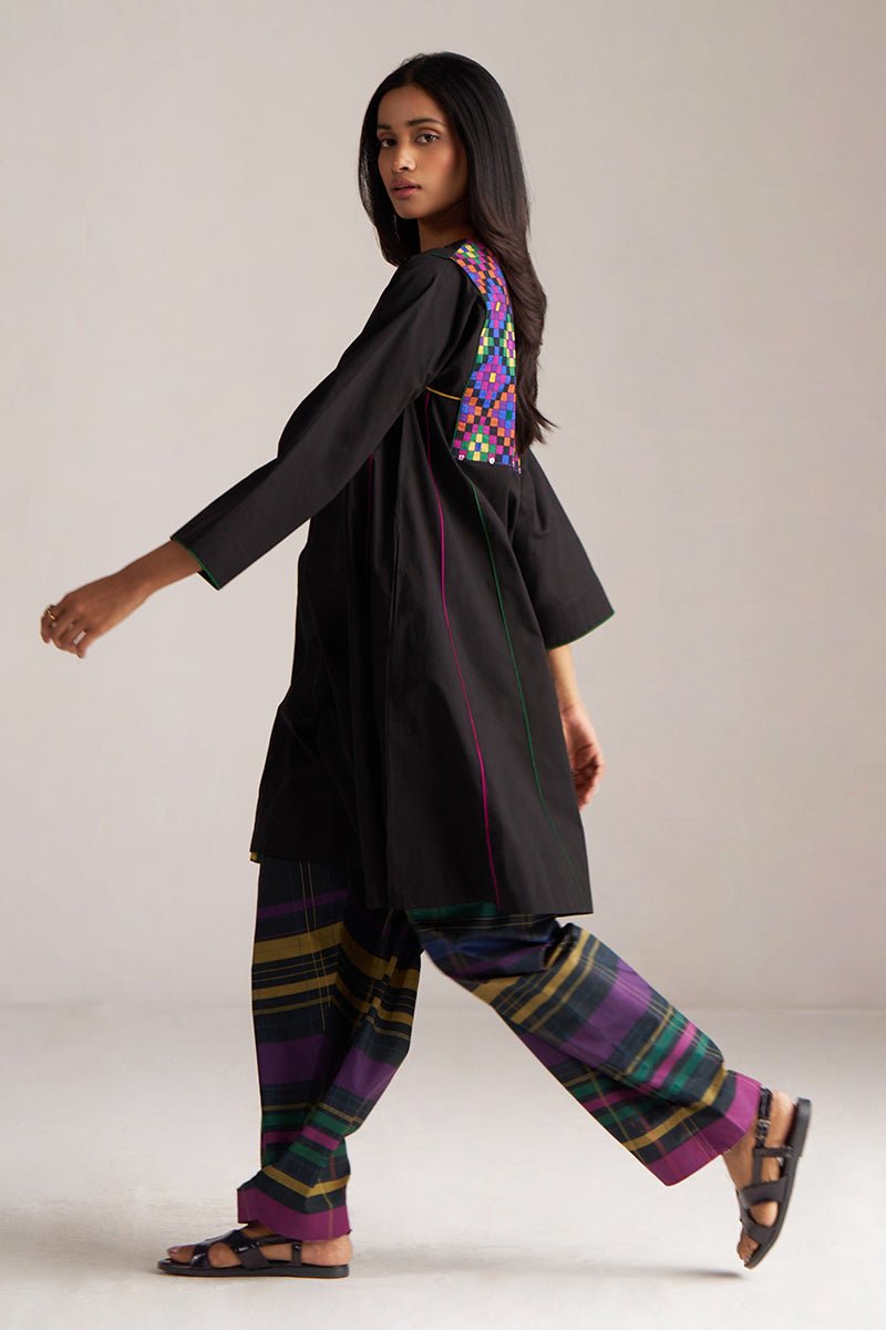 Woman wearing a black outfit with colorful patterns on a plain background | Black Multi Colour Checkard Co Ord Set