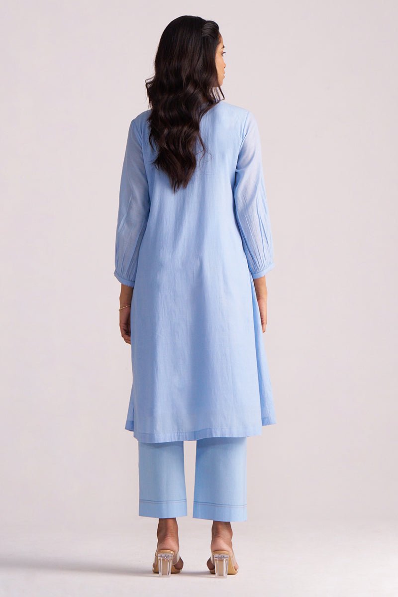 Woman wearing a Airy Blue Mul-Chanderi Co-ord Set on a plain background