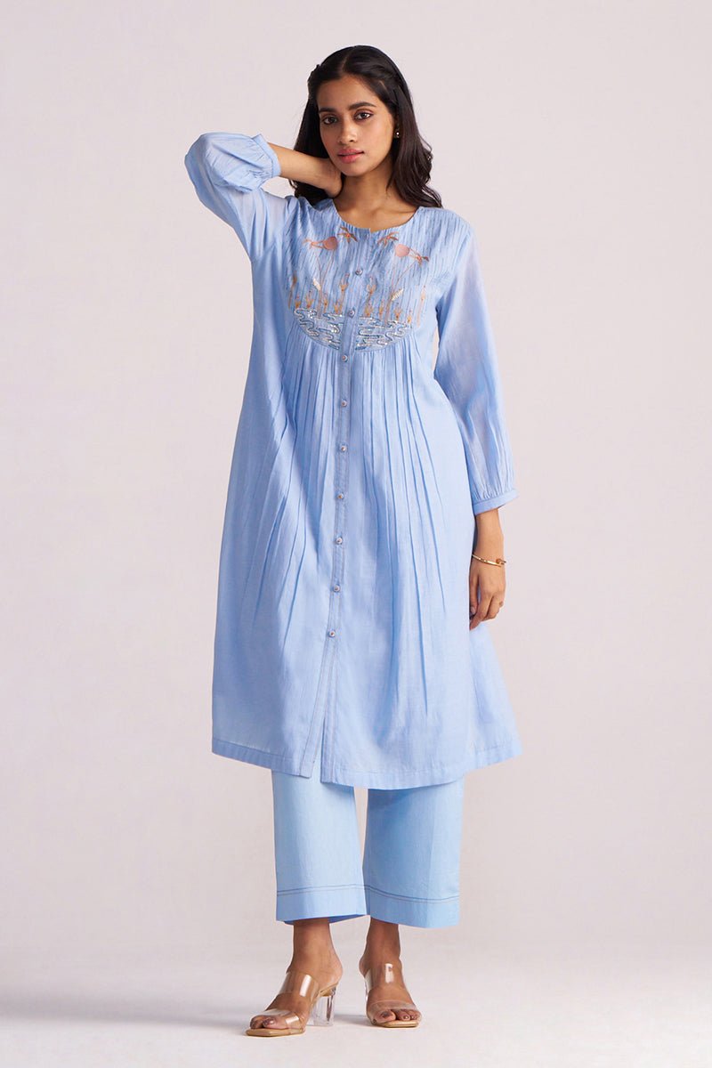 Woman wearing a Airy Blue Mul-Chanderi Co-ord Set on a plain background