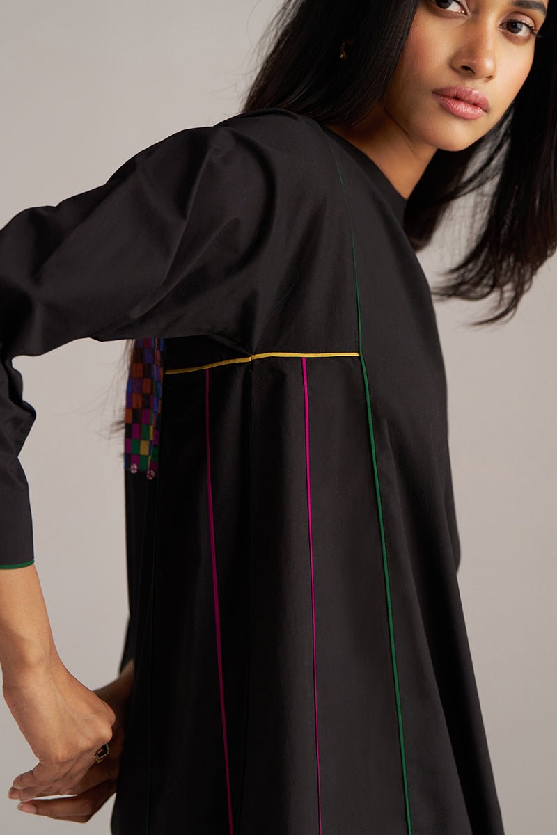 Woman wearing a black traditional outfit with colorful accents on a gray background | Black Multi Colour Checkard Co Ord Set
