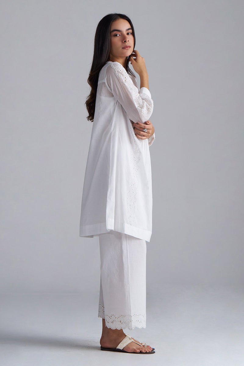 Woman wearing a white outfit with lace details on a plain background, White Mul Mul Co-ord Set for Women | Rangmanch | Ganga Fashions