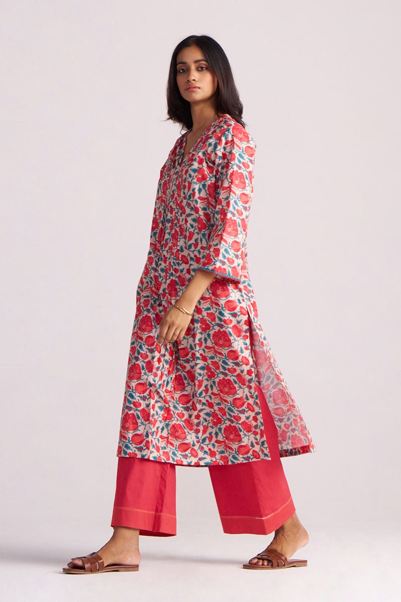 Woman wearing a Beige and Red Cotton Print Co-ord Set on a white background