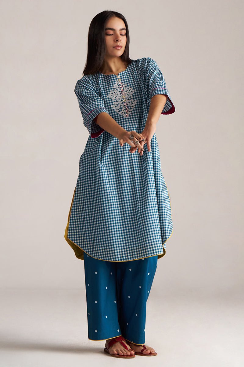 Woman wearing a blue checkered kurta with matching pants on a plain background | Blue and White Mul Mul Checkard Co Ord Set with Stole