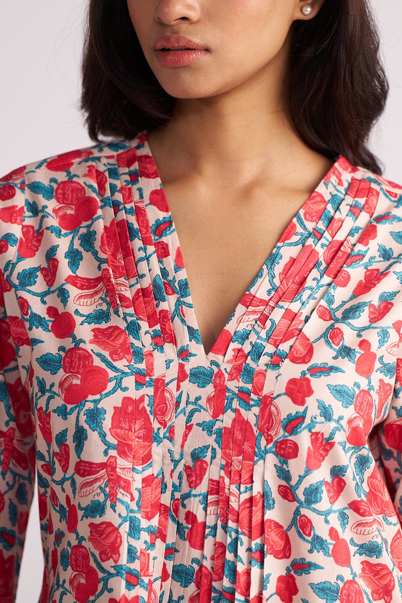 Woman wearing a Beige and Red Cotton Print Co-ord Set on a white background