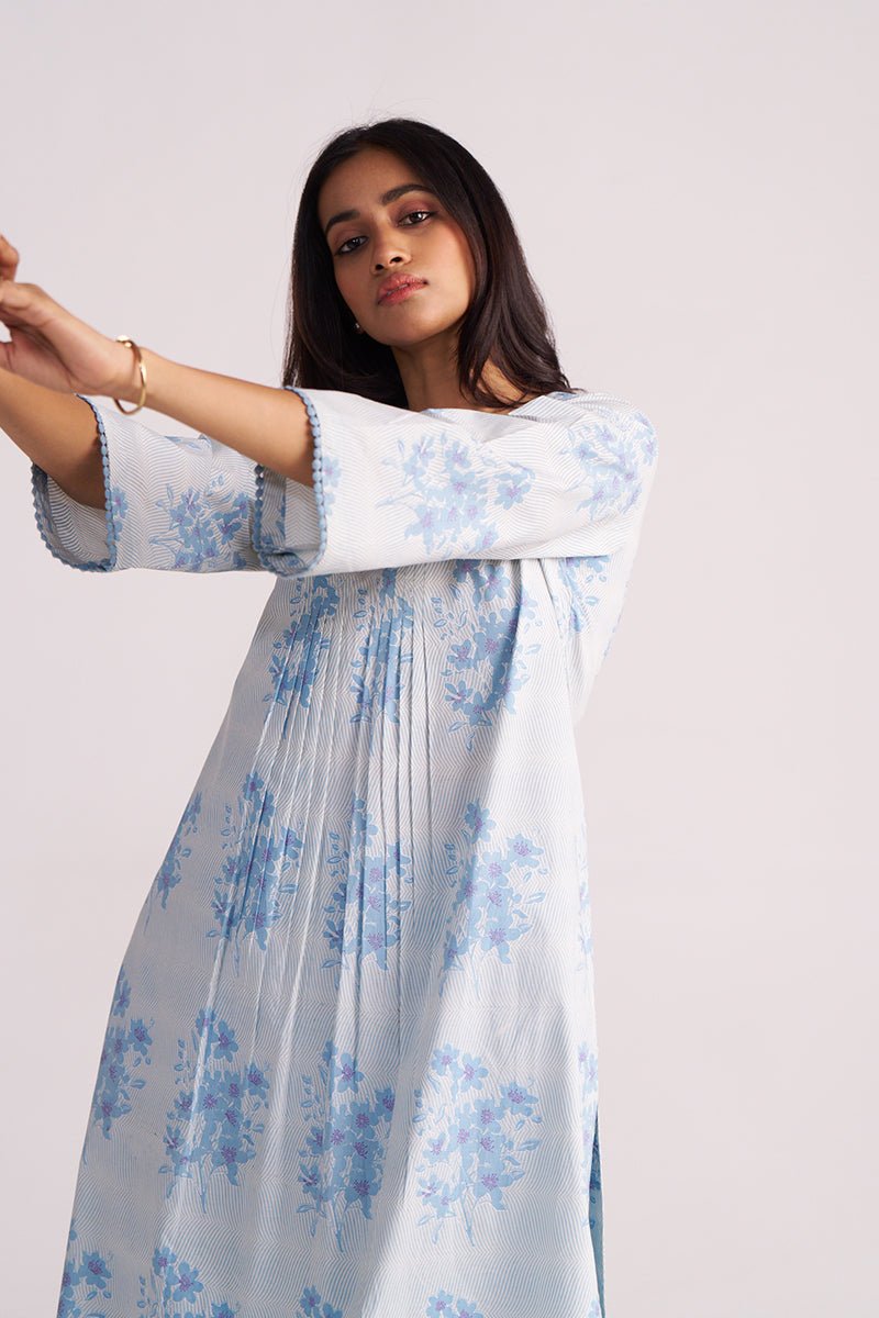 Woman wearing a Cream and Dusty Blue Hand-Print Cotton Co-ord Set with a plain background