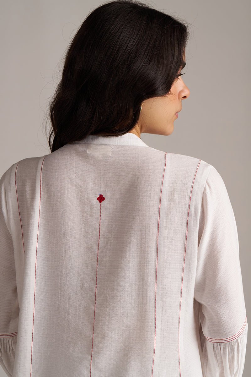 Woman wearing a light-colored shirt with red accents on a plain background, Pure White Co-ord Set for Women | Rangmanch | Ganga Fashions
