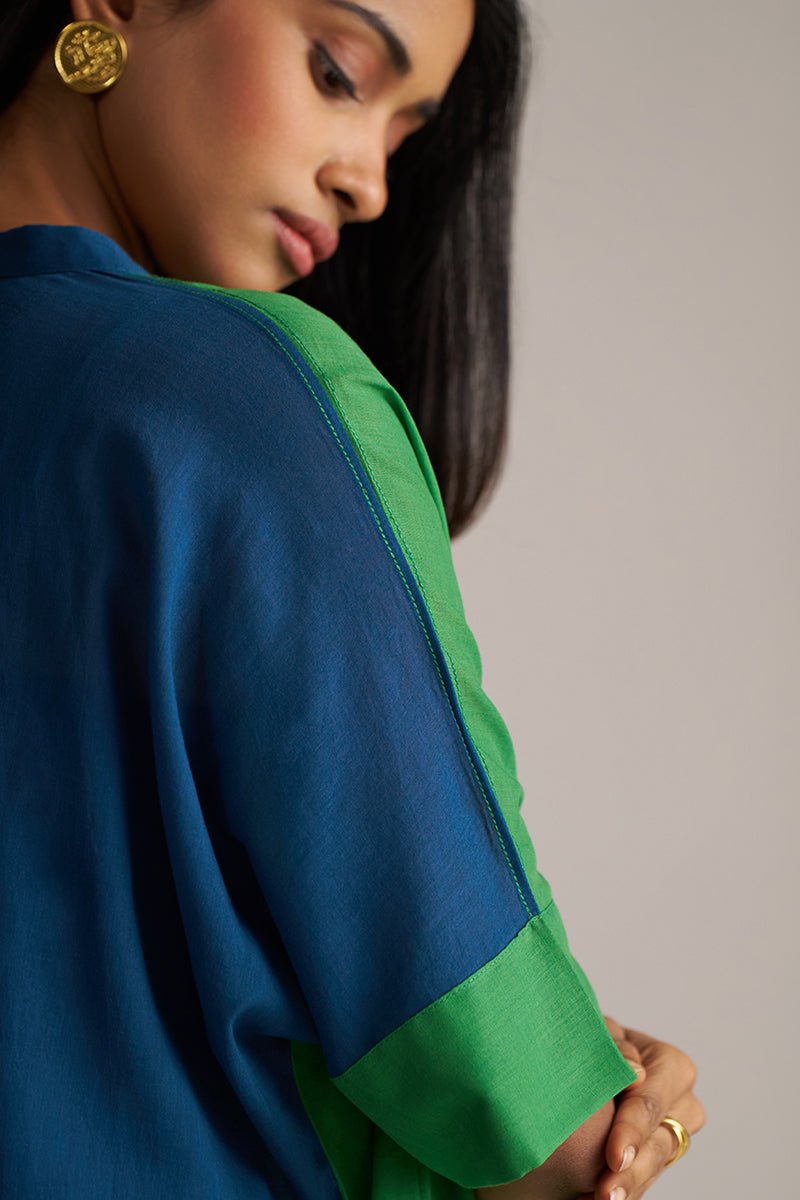Woman wearing a blue and green outfit with a neutral background | Blue and Green Mul Mul Co Ord Set