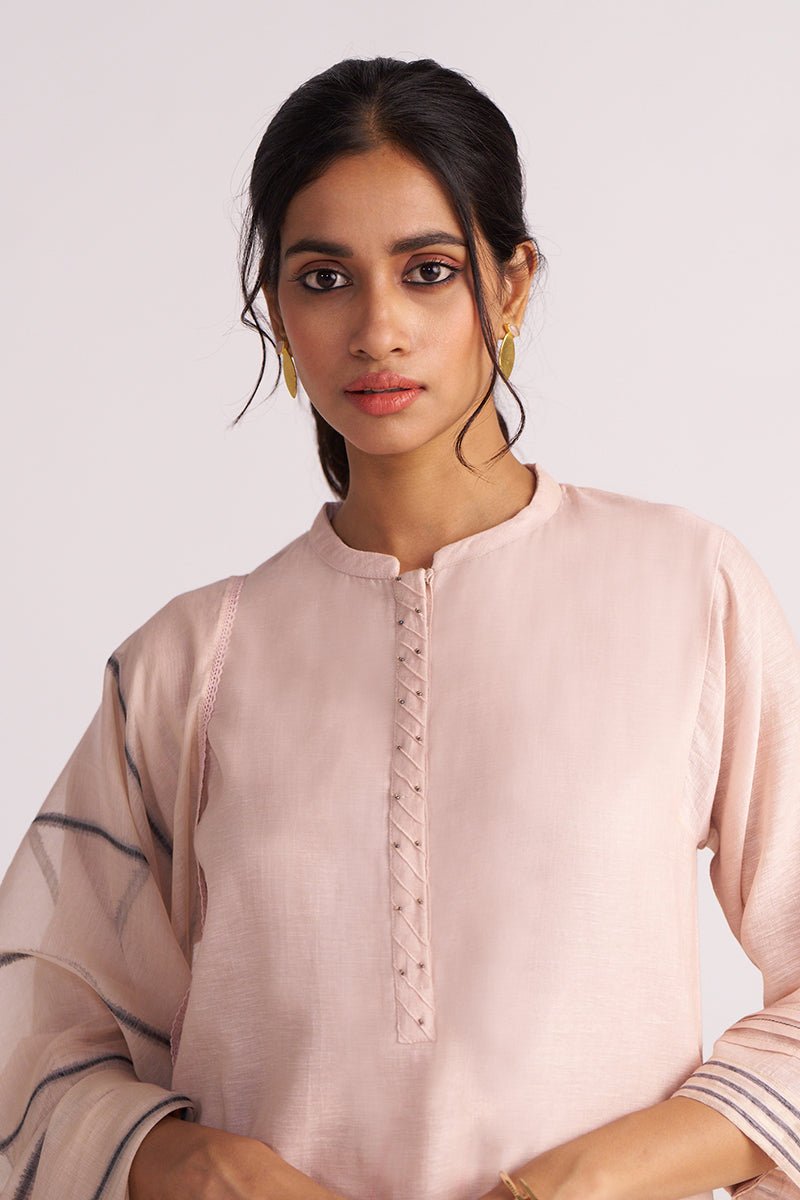 Woman wearing a Sepia Rose Woven Chanderi Kurta Set against a plain background
