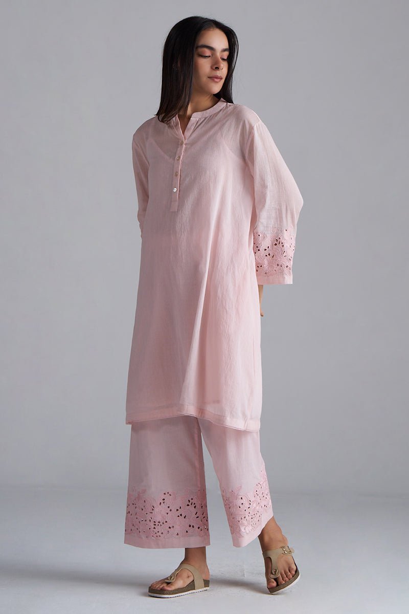 Woman wearing a light pink embroidered outfit on a gray background, Crystal Pink Mul Mul Co-ord Set for Women | Ganga Fashions
