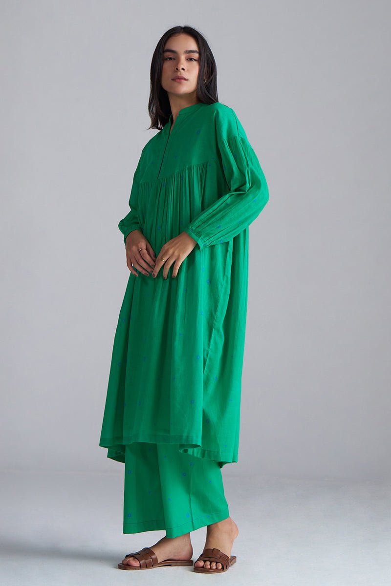 Woman wearing a green dress against a gray background,Holly Green Mul Mul Co-ord Set for Women | Ganga Fashions