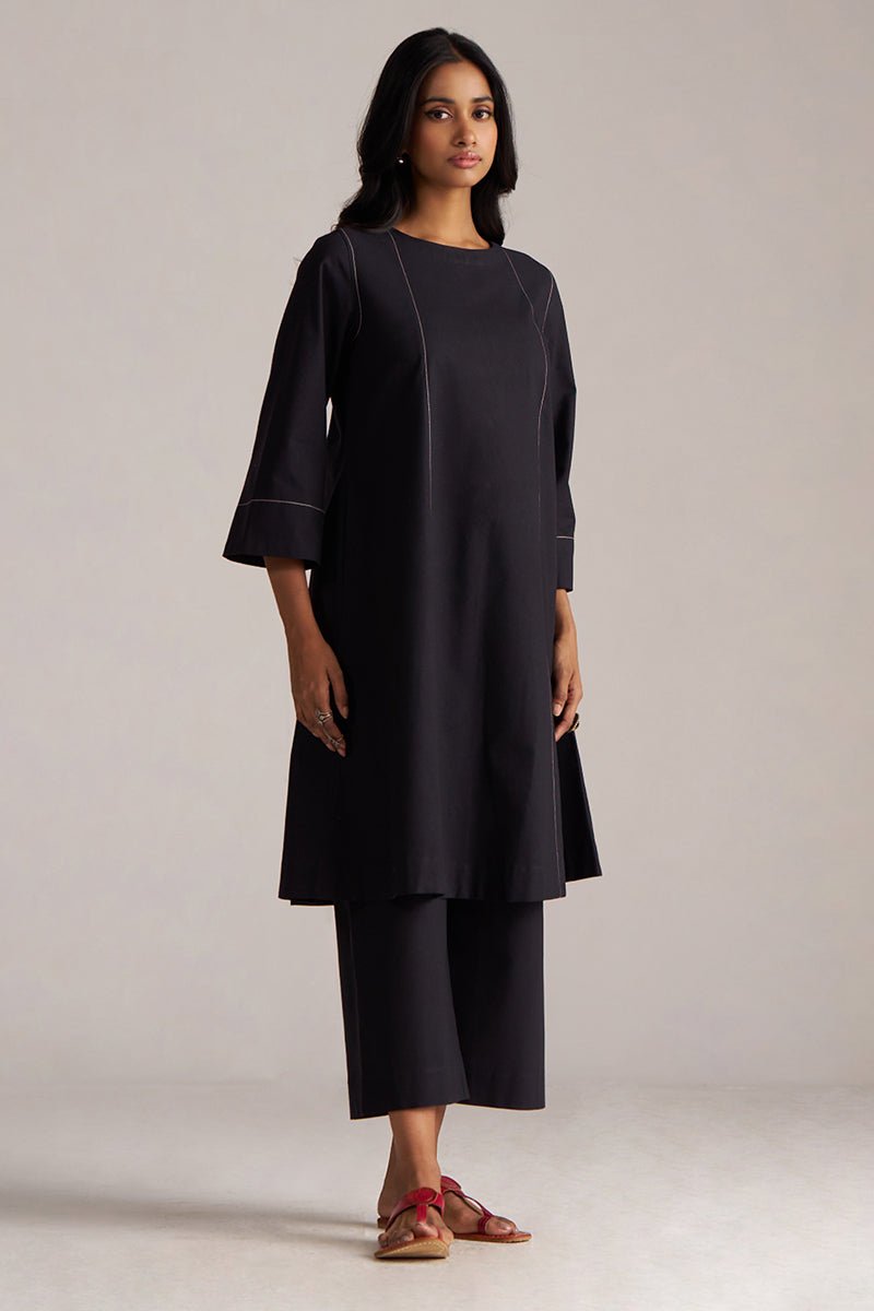 Woman wearing a black dress with a plain background | Black Co-ord Set – Ethnic Wear for Women | Ganga Fashions