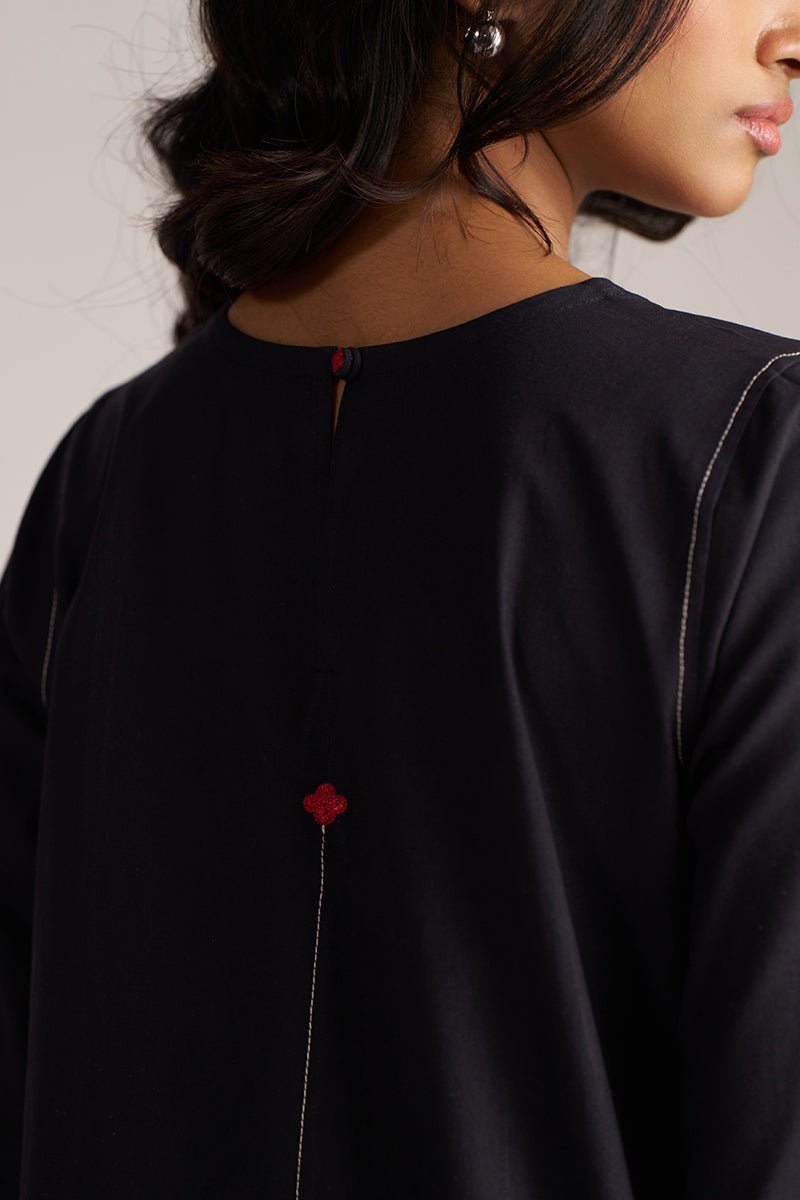 Black garment with red detail on a neutral background | Black Co-ord Set – Ethnic Wear for Women | Ganga Fashions