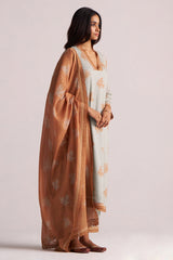 Woman wearing a Grey-Rust Mul Kurta Set on a plain background