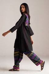 Woman wearing a black outfit with colorful patterns on a plain background | Black Multi Colour Checkard Co Ord Set