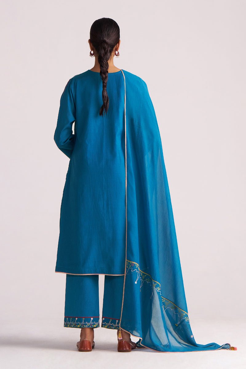 Woman wearing a Celestial Blue Embroidered Kurta Set on a white background