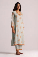 Woman wearing a Grey-Rust Mul Kurta Set with a plain background