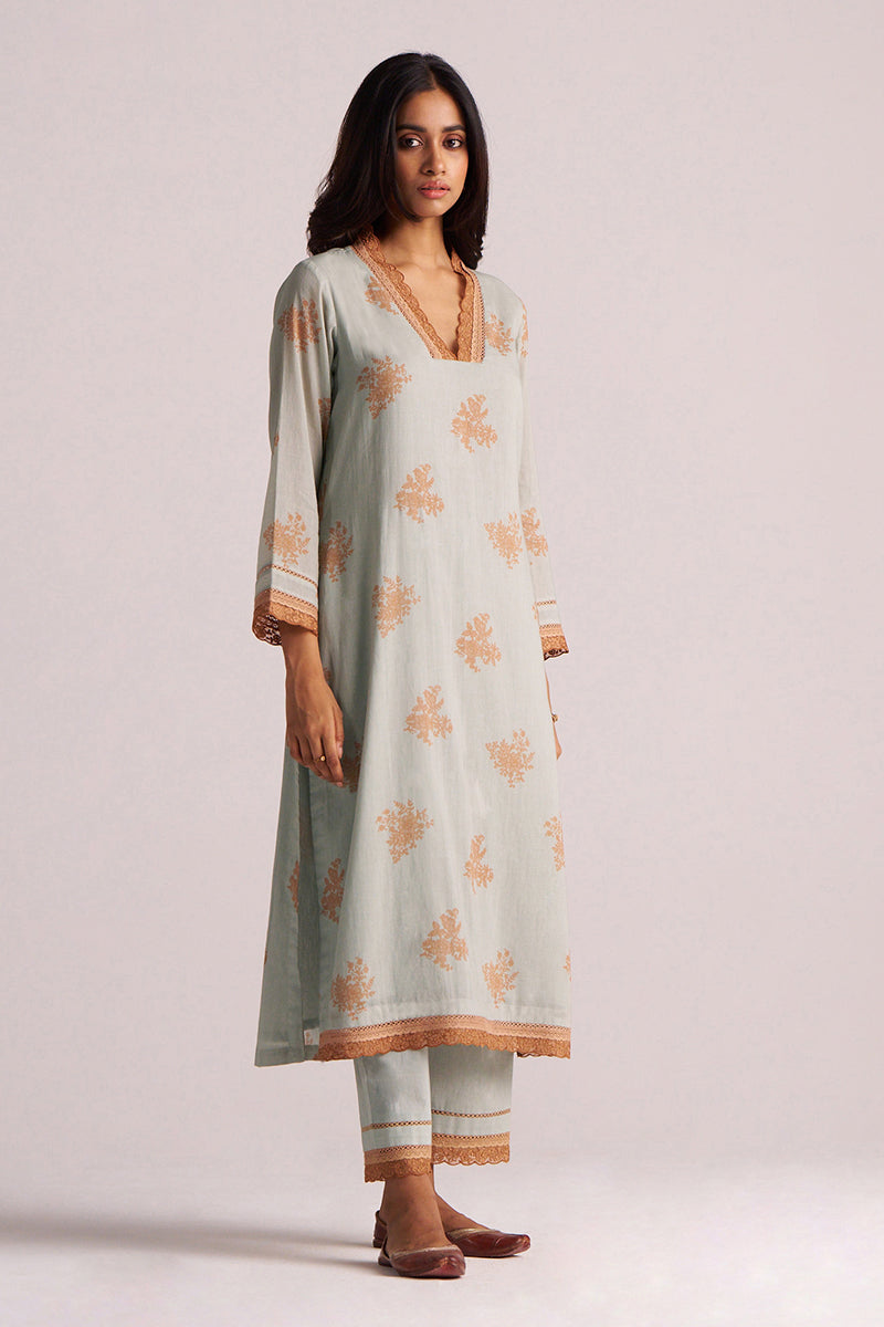 Woman wearing a Grey-Rust Mul Kurta Set with a plain background