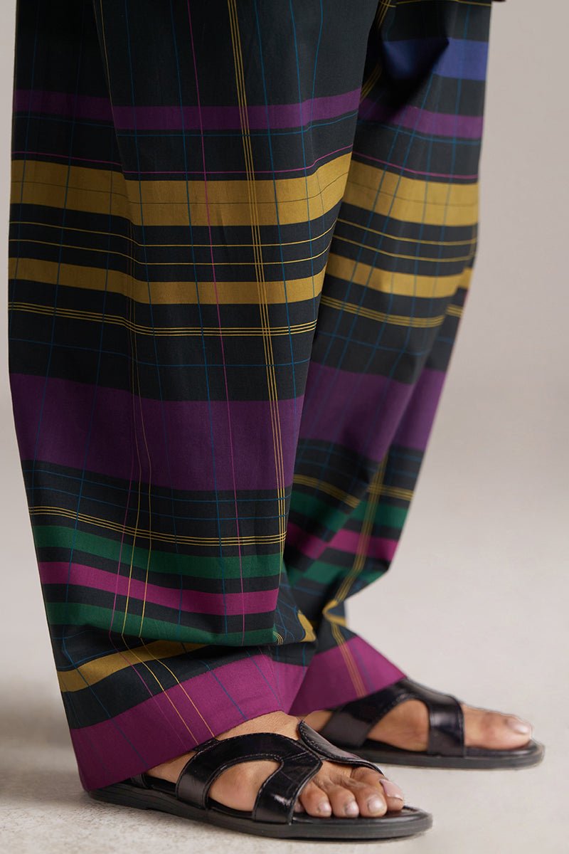 Plaid pants with purple, green, and yellow stripes worn with black sandals on a neutral background | Black Multi Colour Checkard Co Ord Set