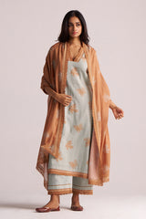 Woman wearing a Grey-Rust Mul Kurta Set on a plain background