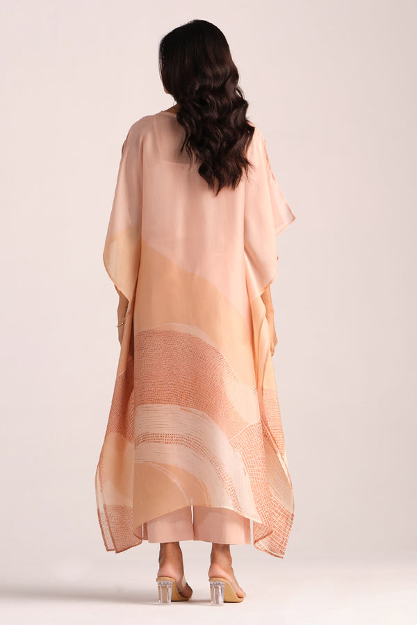 Woman wearing a Spanish Villa Silk Kaftaan Co-ord Set a plain background