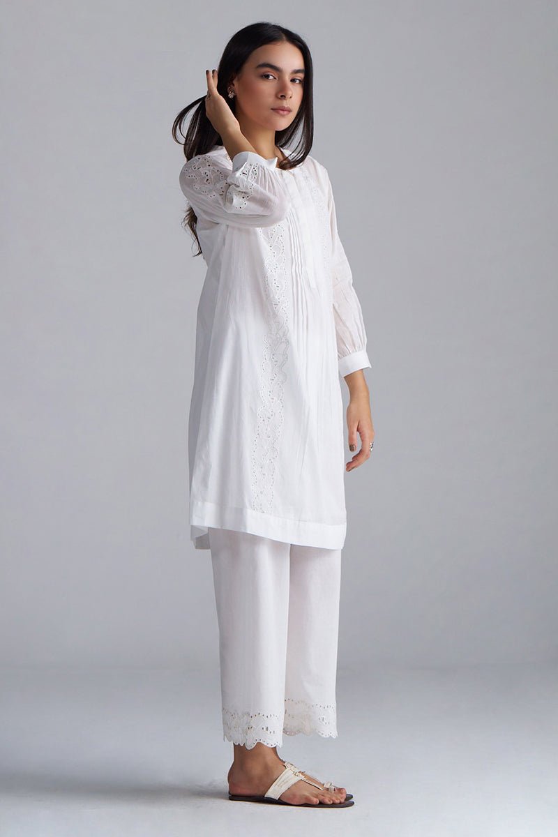 Woman wearing a white outfit with lace details on a plain background, White Mul Mul Co-ord Set for Women | Rangmanch | Ganga Fashions