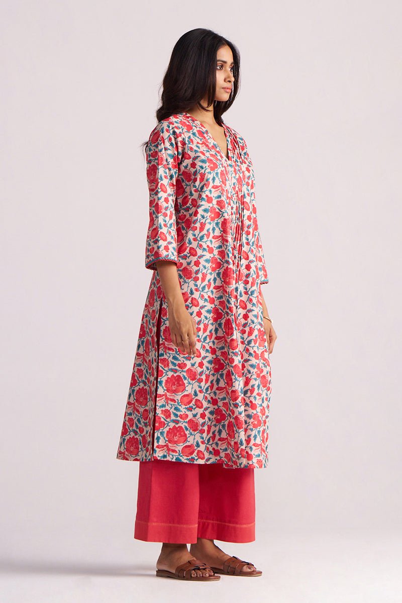 Woman wearing a Beige and Red Cotton Print Co-ord Set on a white background