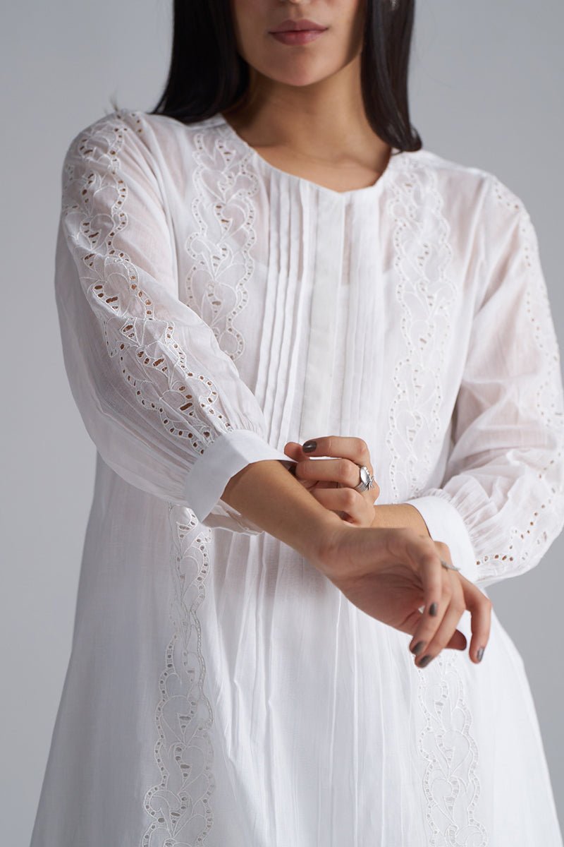 Woman wearing a white dress with intricate lace sleeves against a gray background , White Mul Mul Co-ord Set for Women | Rangmanch | Ganga Fashions