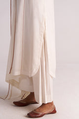 Ivory Embroidered Kurta Set with brown trim and brown shoes on a light background