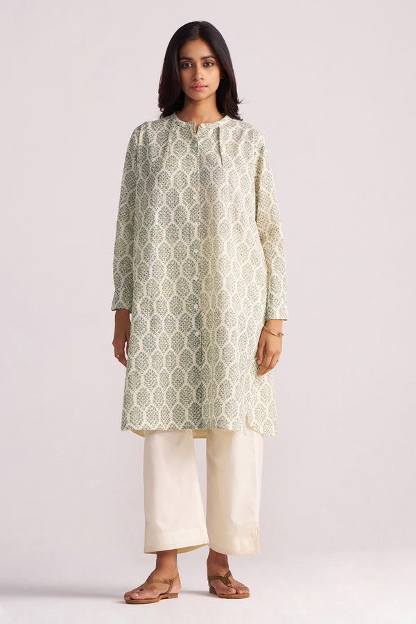 Woman wearing a Cream and Deep Olive Mughal Tree Hand Print Cotton-Linen Co-ord Set on a light gray background