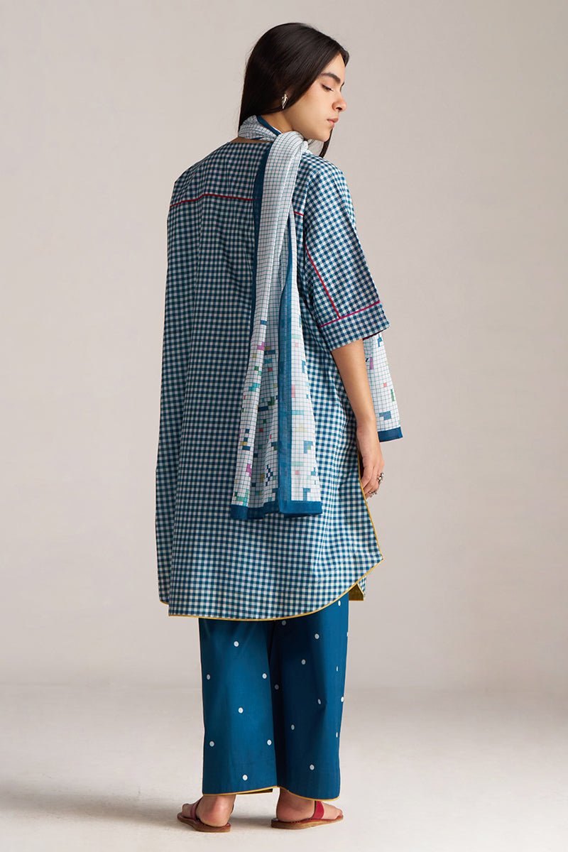 Woman wearing a blue checkered kurta with white pants and a matching dupatta on a plain background | Blue and White Mul Mul Checkard Co Ord Set with Stole