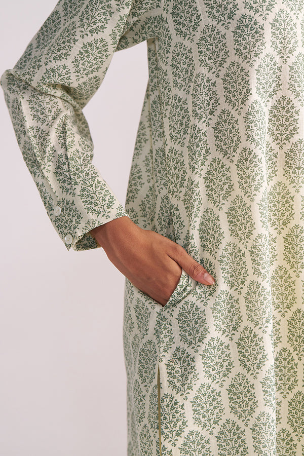 Cream and Deep Olive Mughal Tree Hand Print Cotton-Linen Co-ord Set with a hand in the pocket on a light gray background