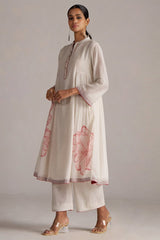 Woman wearing a white kurta with pink floral patterns on a plain background | Buy Ivory and Maroon Pure Chanderi Kurta Set - Ganga Fashions