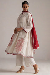 Woman wearing a traditional outfit with a white kurta, red dupatta, and white pants on a plain background | Buy Ivory and Maroon Pure Chanderi Kurta Set - Ganga Fashions