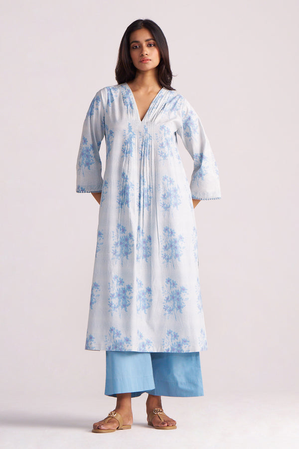Woman wearing a Cream and Dusty Blue Hand-Print Cotton Co-ord Set with a plain background