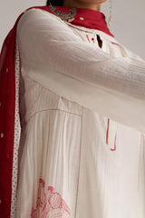 White embroidered garment with red accents worn by a person, against a neutral background | Buy Ivory and Maroon Pure Chanderi Kurta Set - Ganga Fashions