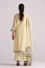Woman wearing a Butter Yellow Chanderi Woven Kurta Set with a scarf on a white background