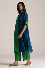 Woman wearing a blue and green outfit on a plain background | Blue and Green Mul Mul Co Ord Set