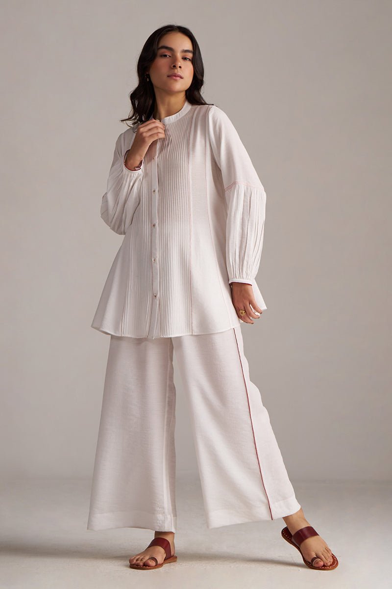Woman wearing a white outfit with wide-leg pants against a plain background| Pure White Co-ord Set for Women | Rangmanch | Ganga Fashions