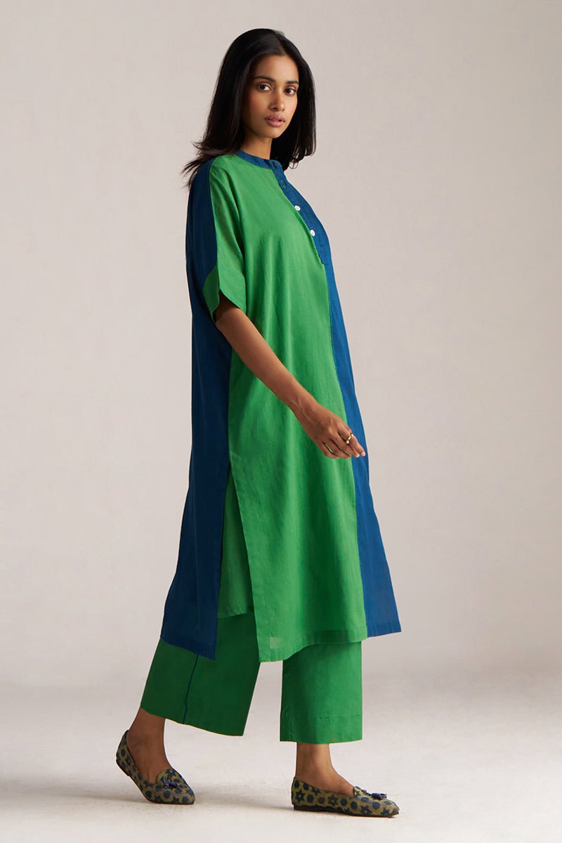 Woman wearing a green and blue outfit on a plain background | Blue and Green Mul Mul Co Ord Set