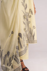 Butter Yellow Chanderi Woven Kurta Set with black floral patterns held by a person on a white background