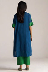 Person wearing a blue and green outfit with a plain background | Blue and Green Mul Mul Co Ord Set