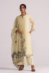 Woman wearing a Butter Yellow Chanderi Woven Kurta Set on a white background