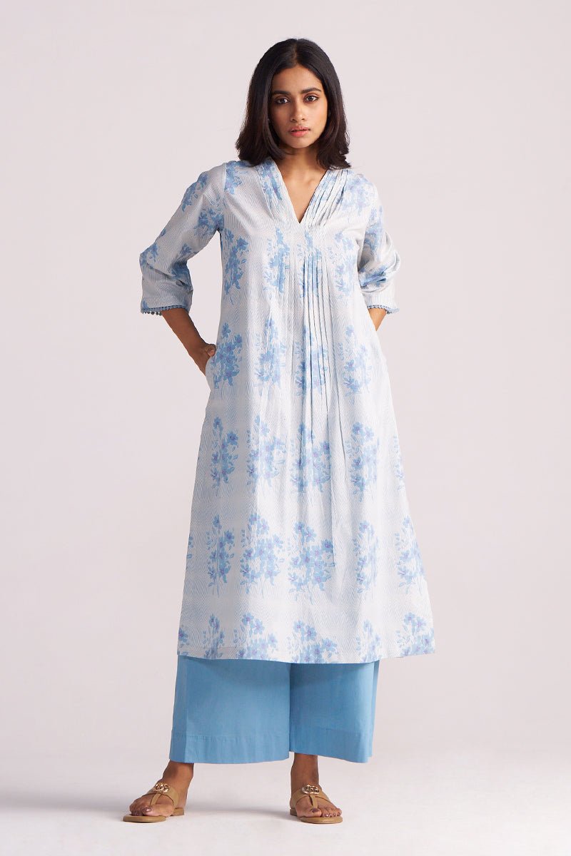 Woman wearing a Cream and Dusty Blue Hand-Print Cotton Co-ord Set with a white background