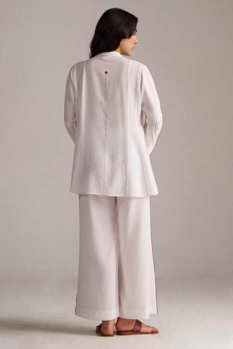 Woman wearing a light-colored outfit with wide-leg pants on a plain background, Pure White Co-ord Set for Women | Rangmanch | Ganga Fashions
