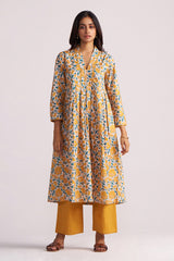 Woman wearing a Beige and Mustard Cotton Print Co-ord Set on a light gray background