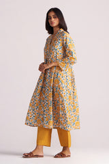 Woman wearing a Beige and Mustard Cotton Print Co-ord Set on a white background