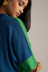 Woman wearing a blue and green outfit with a neutral background | Blue and Green Mul Mul Co Ord Set