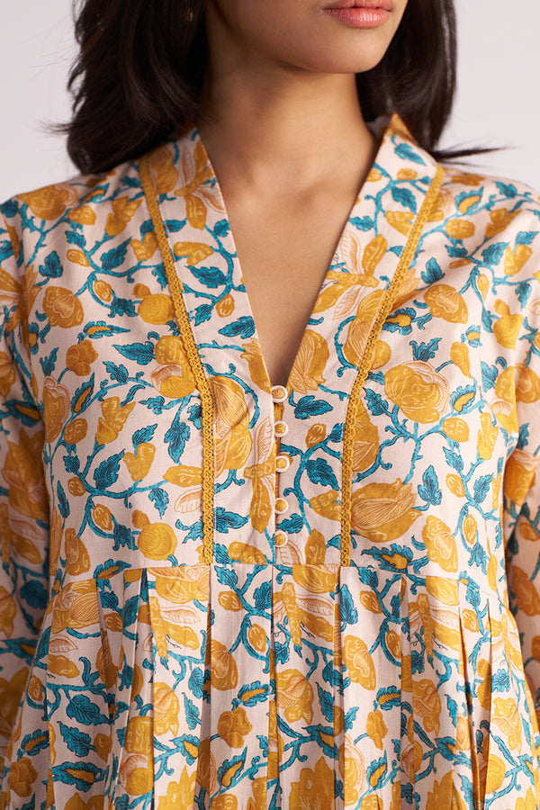Woman wearing a Beige and Mustard Cotton Print Co-ord Set on a white background