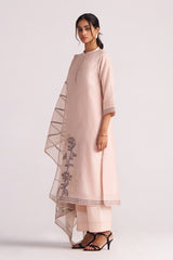Woman wearing a Sepia Rose Woven Chanderi Kurta Set outfit with floral embroidery on a white background